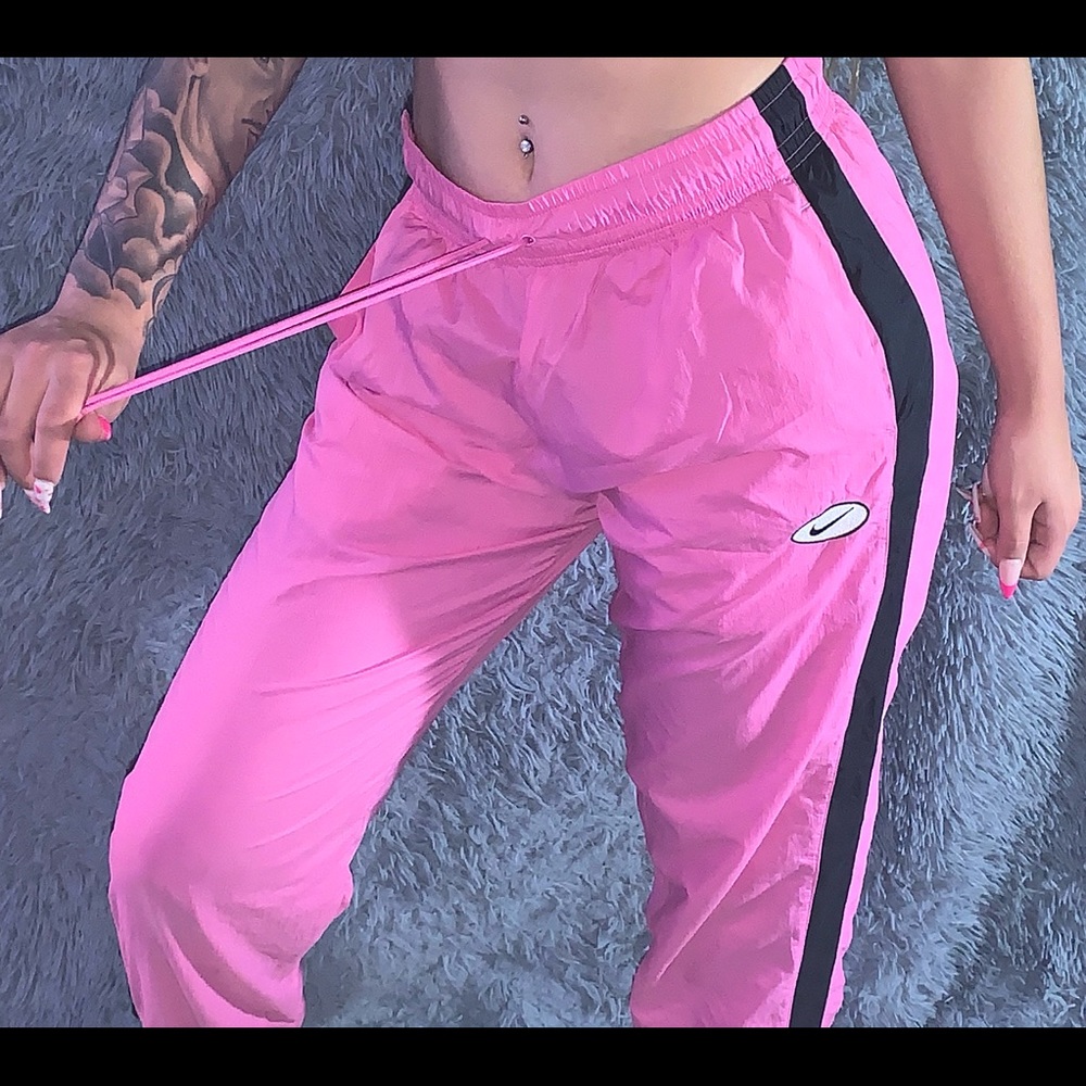 pink NIKE track joggers